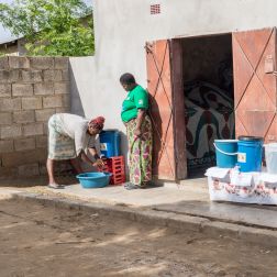  Lindah Lungu and Alice Tembo, washing her hands at an Oral Rehydration Treating Point (ORTP) Center set up by Oxfam partner, Keepers Zambia Foundation during a cholera outbreak 