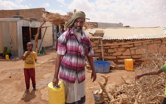 Collecting clean water from Oxfam