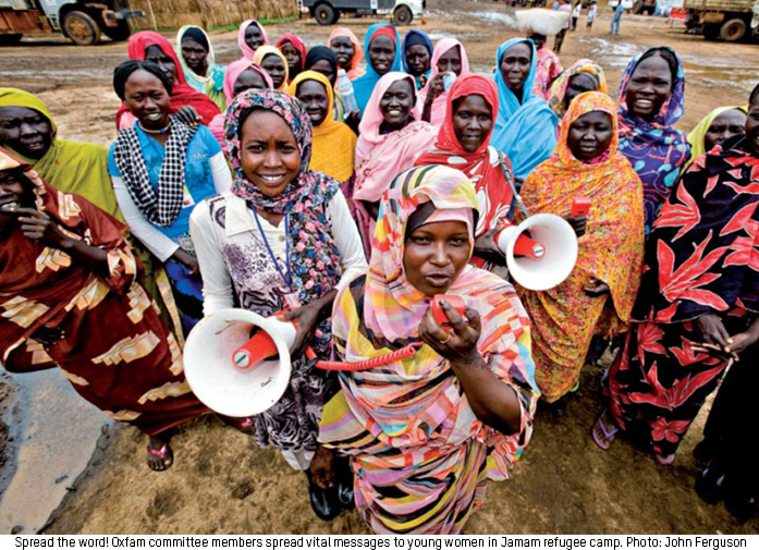 Spread the word! Oxfam committee members spread vital messages to young women in Jamam refugee camp. Photo: John Ferguson