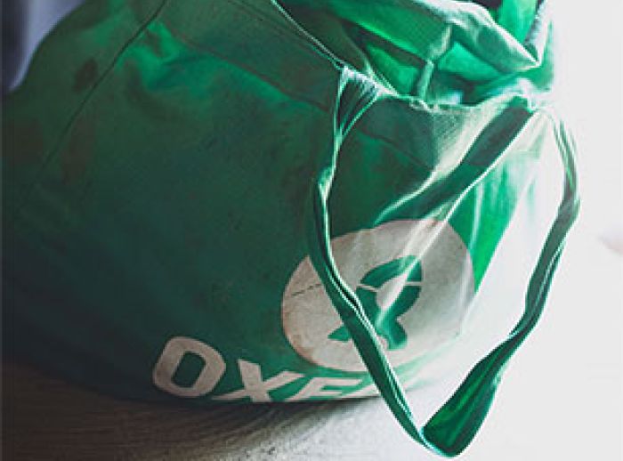 Oxfam bag with tailored clothes