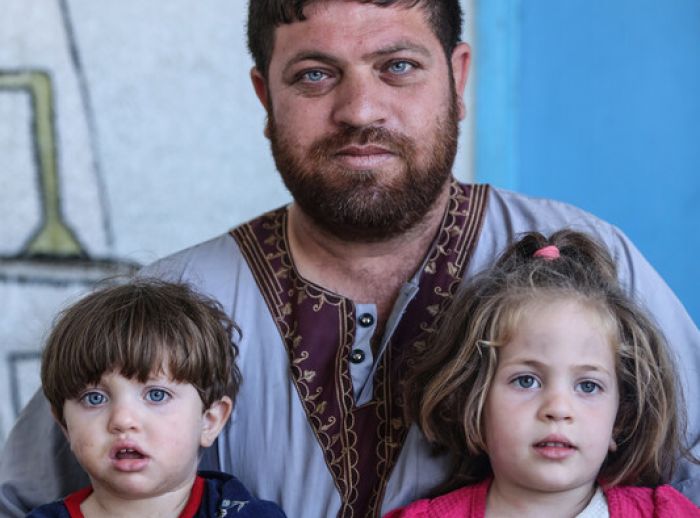 Nael and his children at an UNRWA school for displaced people in Gaza