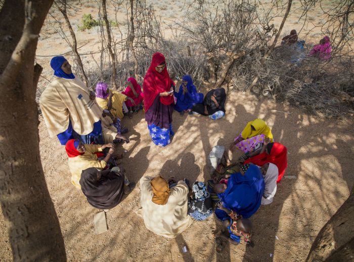 Ibaado Mohamed leading a meeting with women