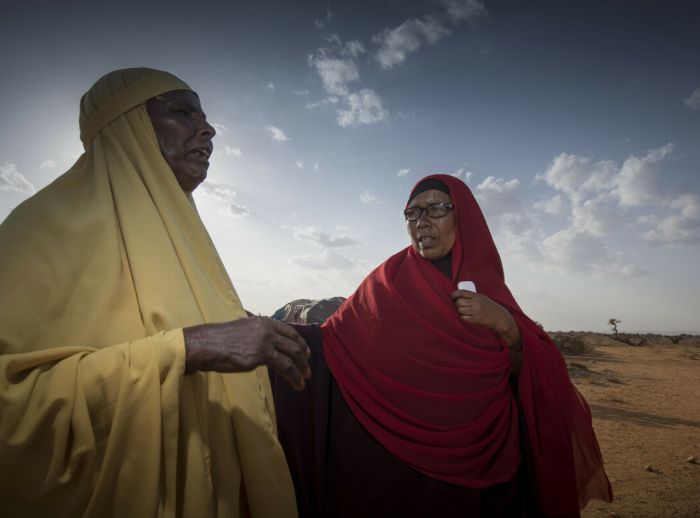 Ibaado Mohamed and woman talking