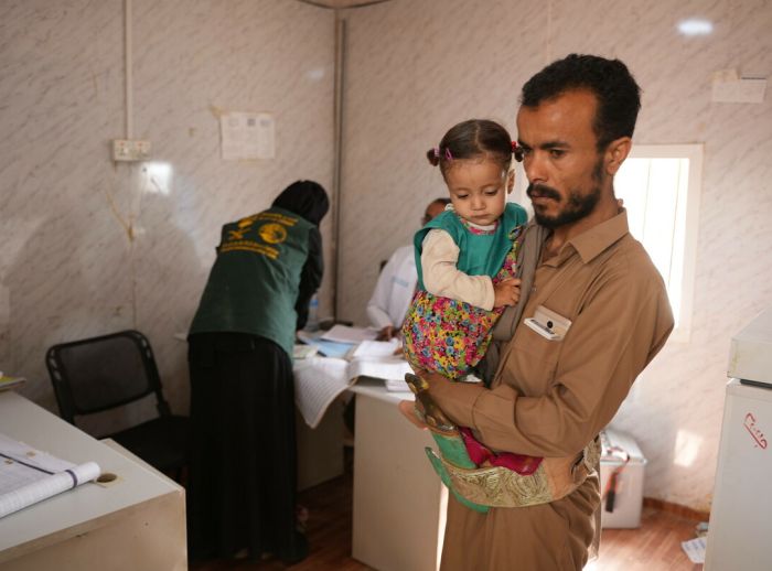 Mufethel Ahmed Ahmed Ismail Al-HaraziI and his daughter in the local hospital