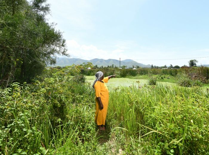 Rehema looking towards the flooding area