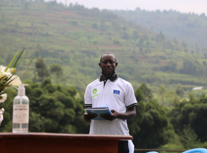 Jean Pierre Havugimana expressing the many benefits the cooperative members will gain with the cold room established for flowers.