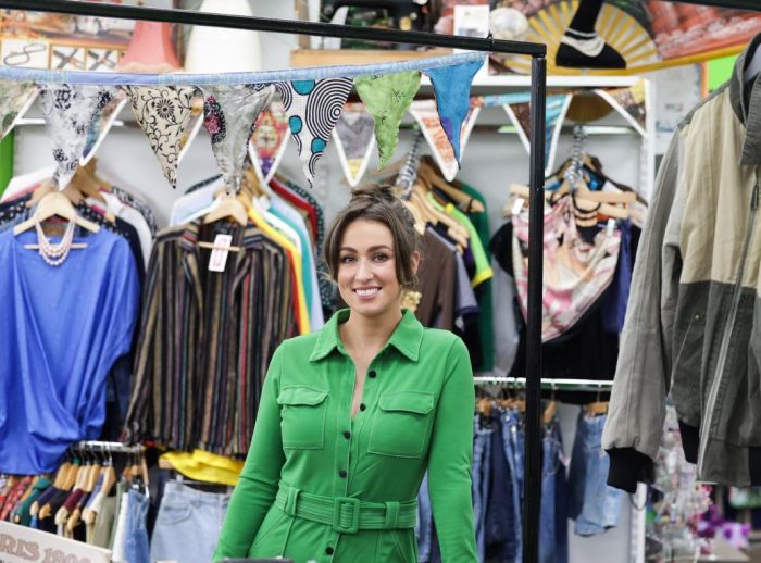 Fiona, store manager standing in the middle of the vintage section of the Oxfam Holywood Superstore.