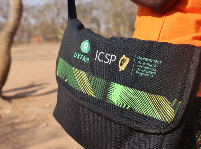 Bag with the logos of Oxfam, ICSP and the Government of Ireland