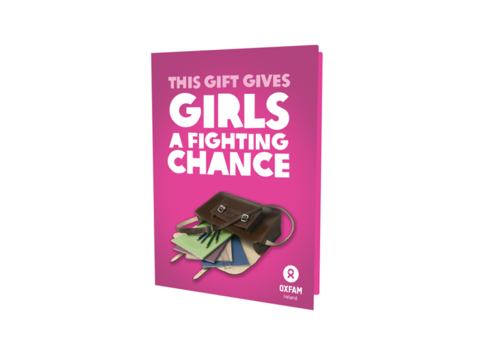 Image of our Girls education card, the card is dark pink with "This gift gives girls a fighting chance" written on the top and an image of a school bag bellow.