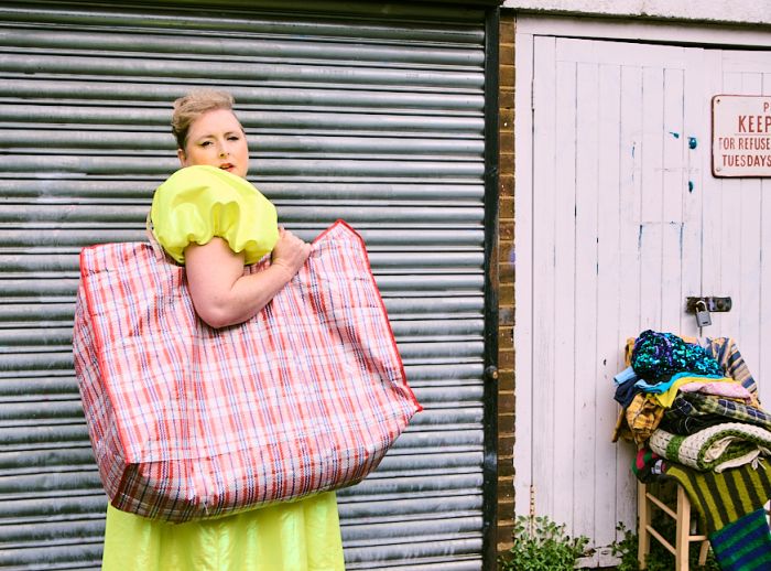 Siobhan McSweeney with a big bag of clothes to donate