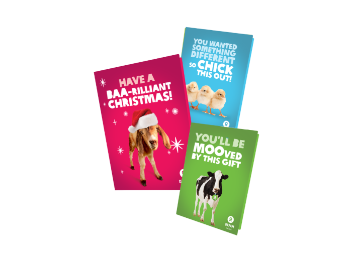 Image of our Animal bundle unwrapped cards. 3 cards, one red with a goat with a Christmas hat "have a BRAA-rilliant christmas!", a cow card "You'll be MOOved by this gift" and the last one features 3 chicks "you wanted something different so chick this out!"