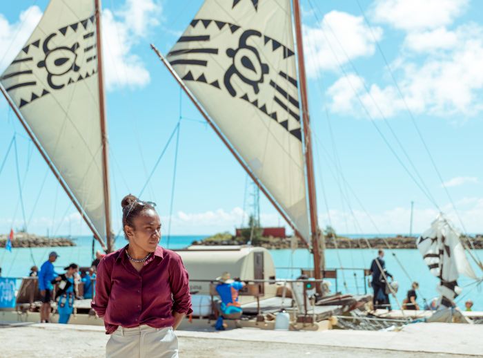 Cynthia Houniuhi in front of the Uto ni Yalo boat at Nuku'alofa during the Pacific Island Forum.