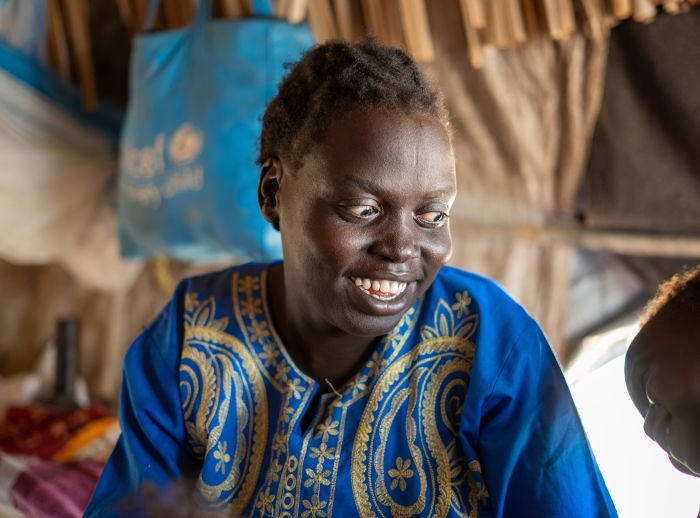 33-year-old Ayul Ajak, a visually impaired mother of six and refugee from the brutal Sudan war at her makeshift home in South Sudan