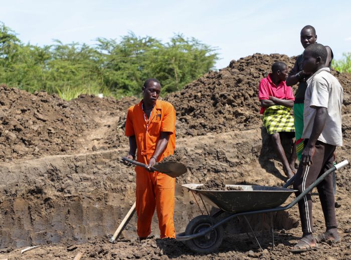 Farmers are growing vegetables near the ponds