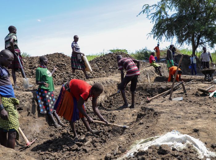 Farmers are growing vegetables near the ponds