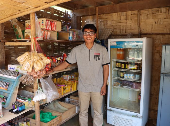 Chansouk standing in his shop