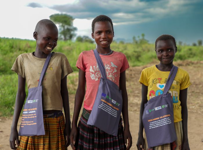 Three children taking part in "From Mines to School” project