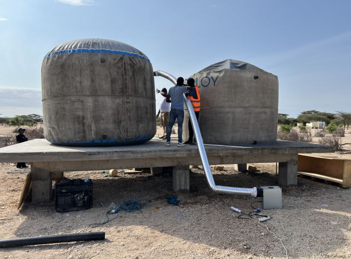 Air being pumped into tank to inflate.