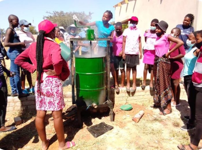 Community in Zimbabwe working on a solar-powered borehole