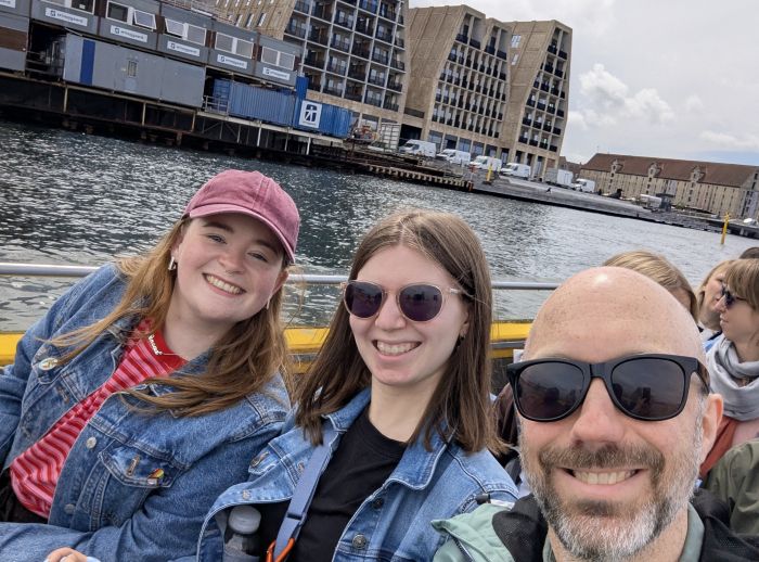 Sinead, Aimee and Garry travelling in a boat in Denmark