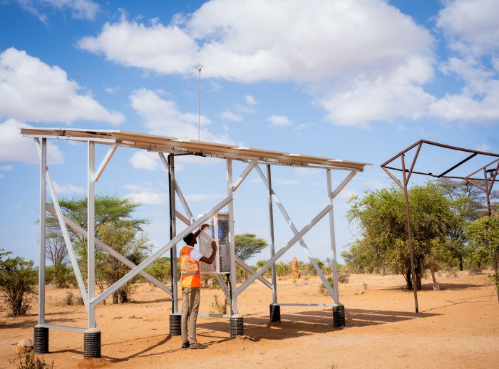 Davis & Shirtliff representative Billow Ismail monitoring the installed solar power system in Nawamor village.