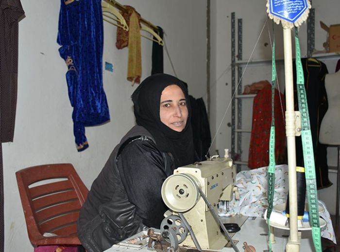 Syrian dressmaker returns to her livelihood