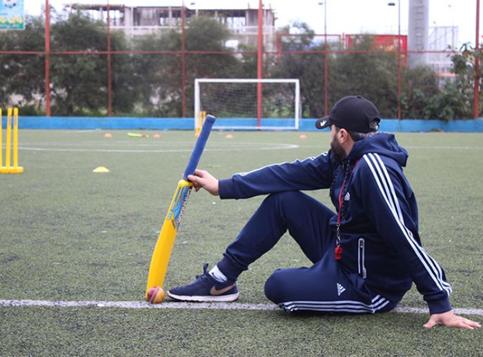 Syrian refugee works as a football coach