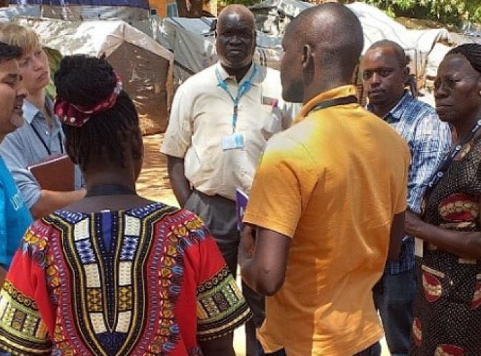 Margaret conversing with partners during a visit to IDP camps in Wau, South Sudan