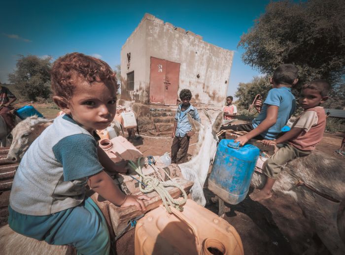 Children using the solar powered water system