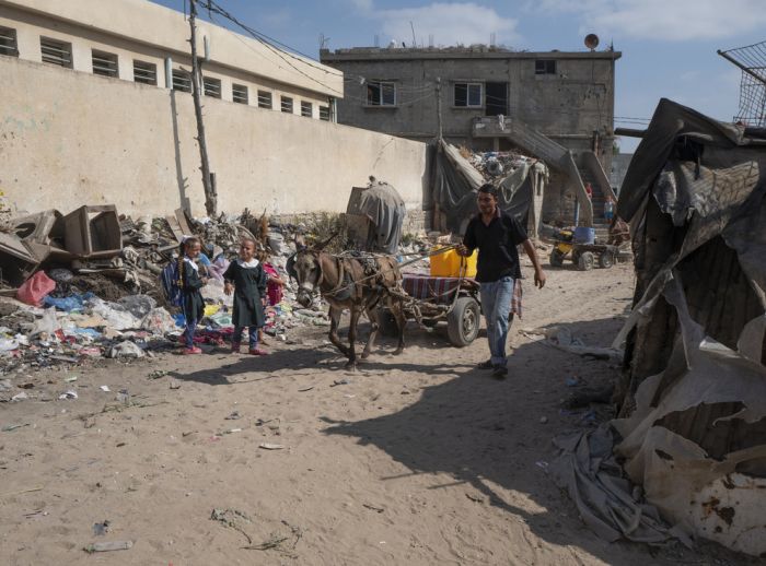 Ahmed taking his donkey out to find water