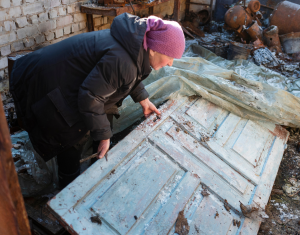 Lady recovering parts of her house in Ukraine