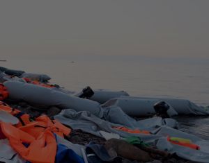 refugee dinghy boat washed off the coast