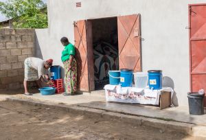  Lindah Lungu and Alice Tembo, washing her hands at an Oral Rehydration Treating Point (ORTP) Center set up by Oxfam partner, Keepers Zambia Foundation during a cholera outbreak 