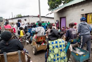 group of people waiting waiting to receive Non-food items (NFIs) from Oxfam partners