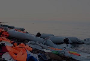 refugee dinghy boat washed off the coast