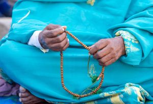  a newly arrived refugee from the Sudan brutal conflict praying while she awaits to be registered in Renk transit camp, South Sudan.