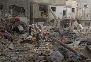 Man travelling to his home or the remains of his home in North Gaza Governorate.