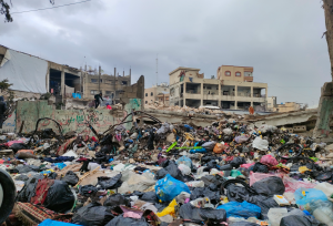 Gaza destruction shoes bags of rubble and belongings strewn all over the destroyed buildings.