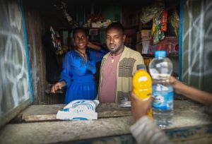 Simegn Hailu and her husband behind the counter of their small business