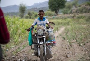Munadhel working with his motorbike