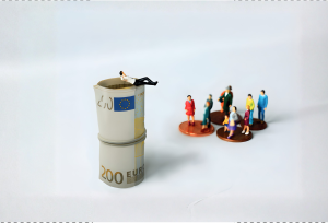 Representation of super rich sitting on roll of €200 bills will the rest of the people have pennies.