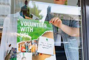 Volunteer promoting recruitment in store