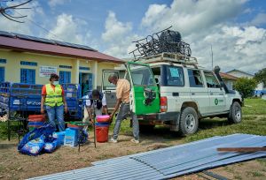 Teams outside a white van in DRC.