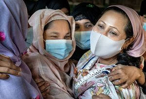 Women laughing at the RWWS women's centre inside a camp in Cox's Bazar, Bangladesh