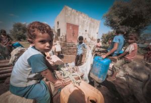 Children use Oxfam's solar powered safe clean water system