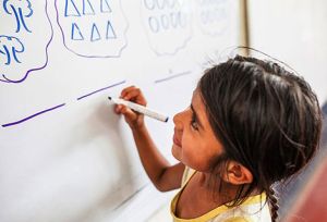 Girl writes with passion at school
