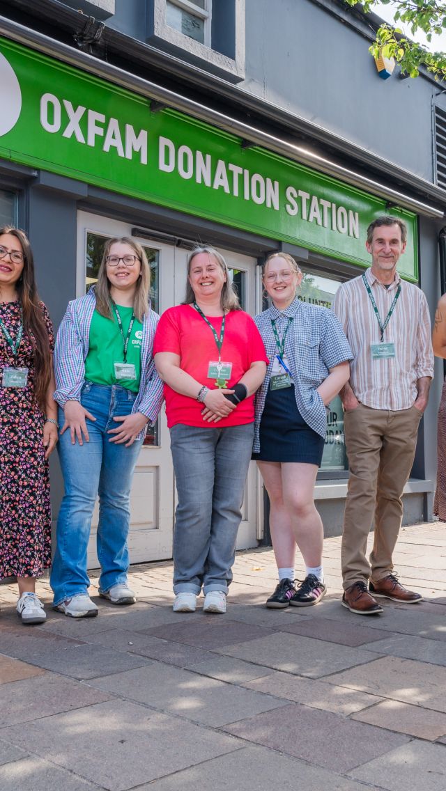 Group picture with staff and volunteers in front of the Oxfam Holywood superstore.