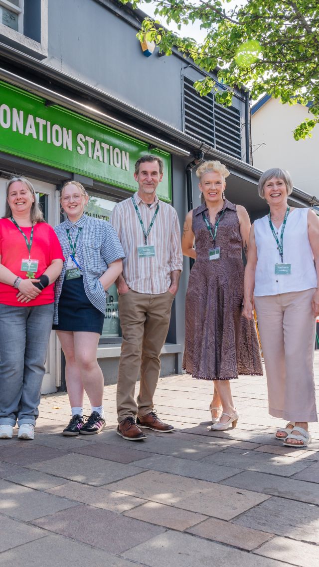 Group picture with staff and volunteers in front of the Oxfam Holywood superstore.
