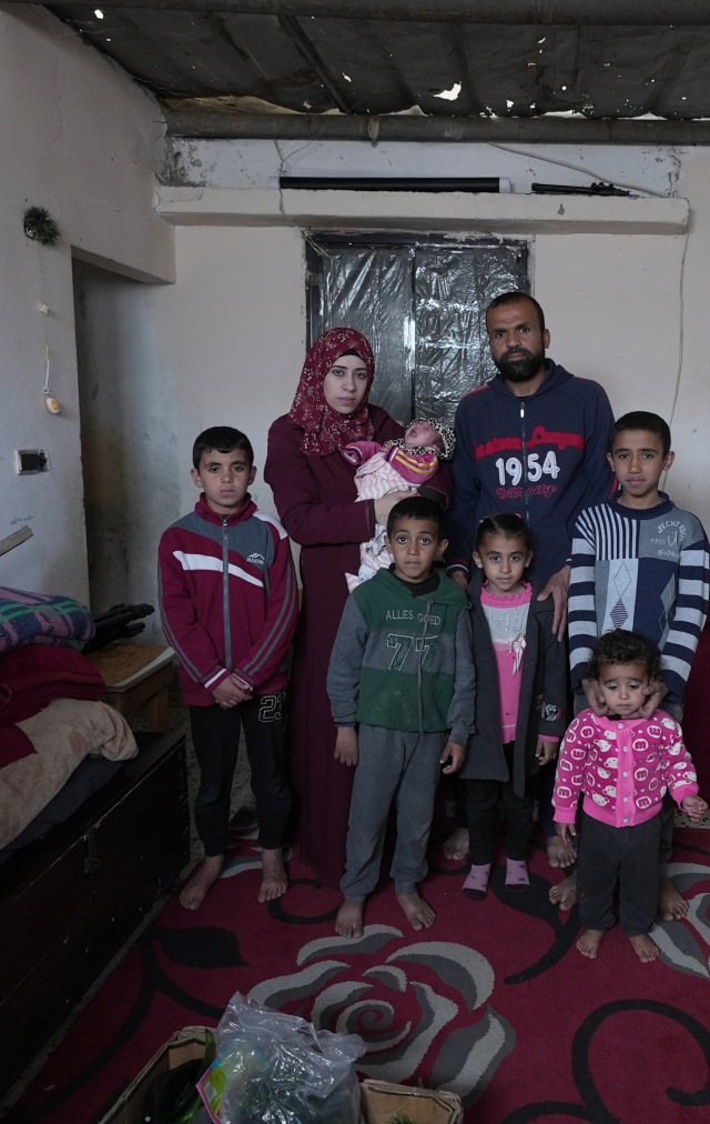 Suhad, her husband, 5 children and a new born struggling to find food.