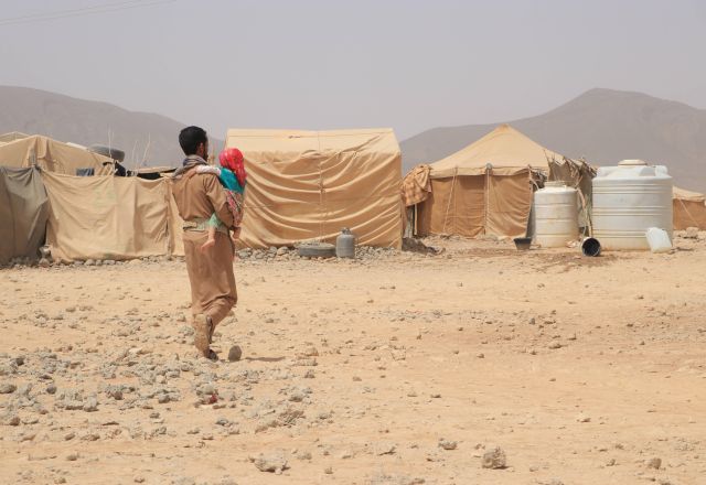 Mofadal and her daughter walking